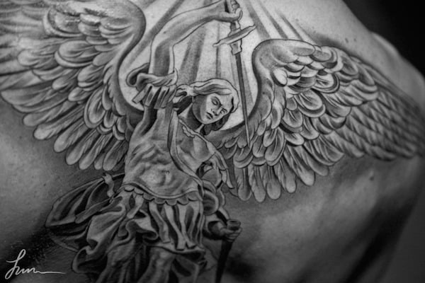 Fighting Guardian Angel Tattoos With A Sword
