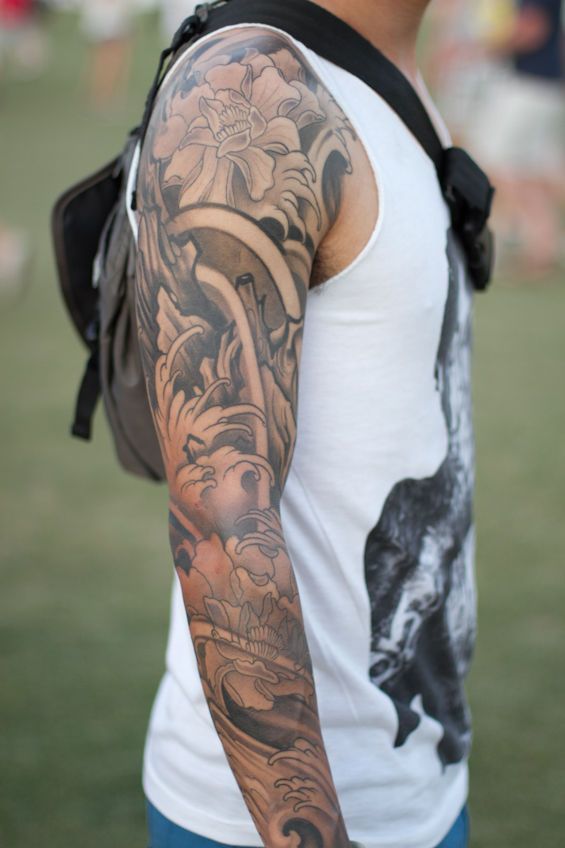 Multi Section Full Arm Tattoos by tattoo artist