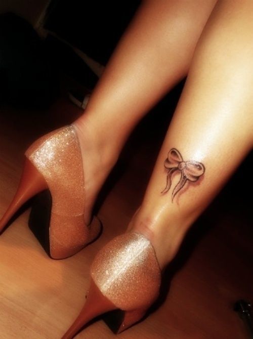 Bow and heart tattoo