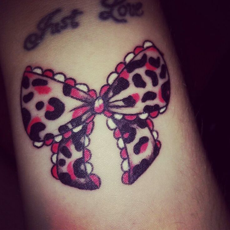 Pink bow on lower back