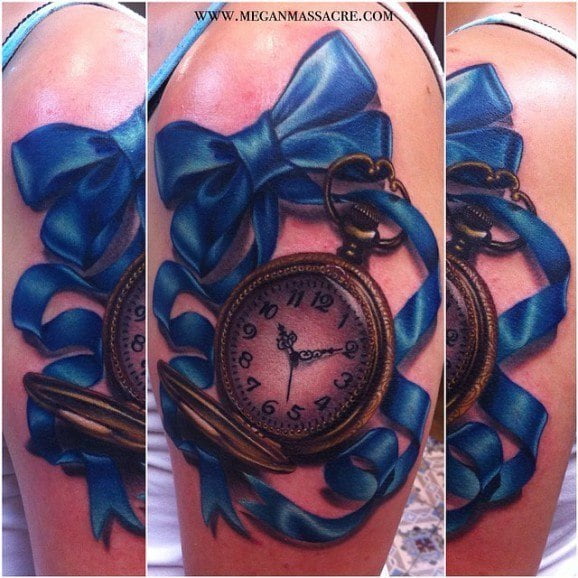 Lace bow tattoo on thigh