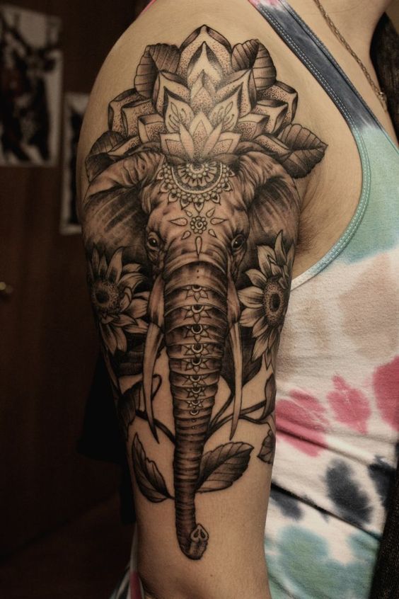 A big nicely decorated mandala elephant tattoo on the arm