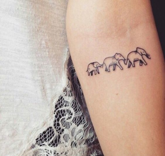 Elephant family tattoo on the arm