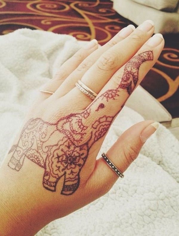 A beautiful mandala elephant tattoo on the hand and finger
