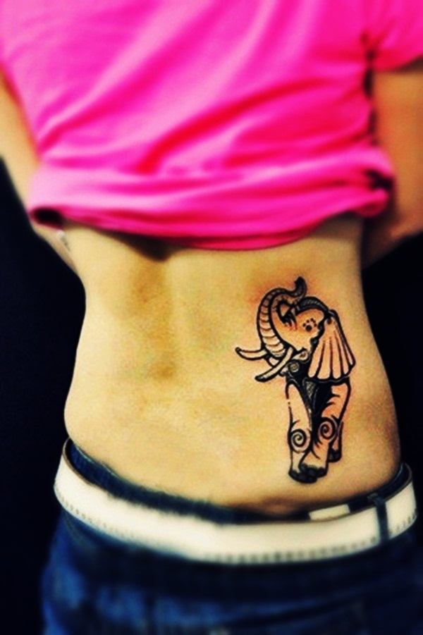 A dark simple running elephant tattoo design on the stomach