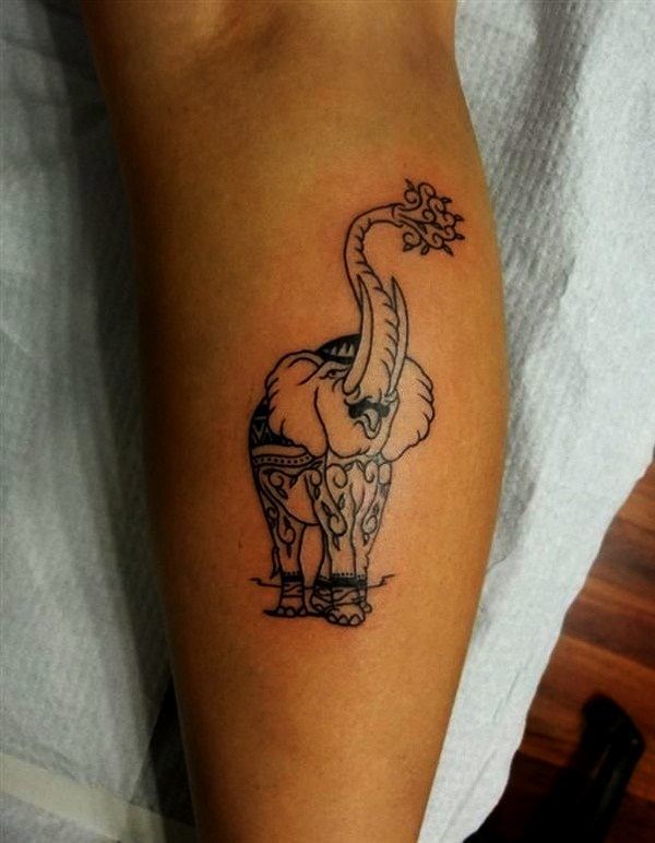 A beautifully decorated elephant tattoo design on the leg