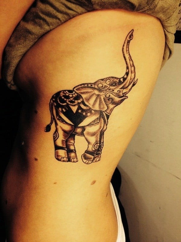 A clothed elephant arm tattoo