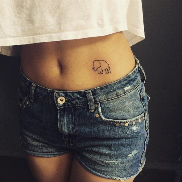 A cute elephant tattoo on the belly of a lady