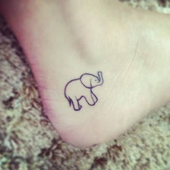 A small elephant tattoo on the ankle