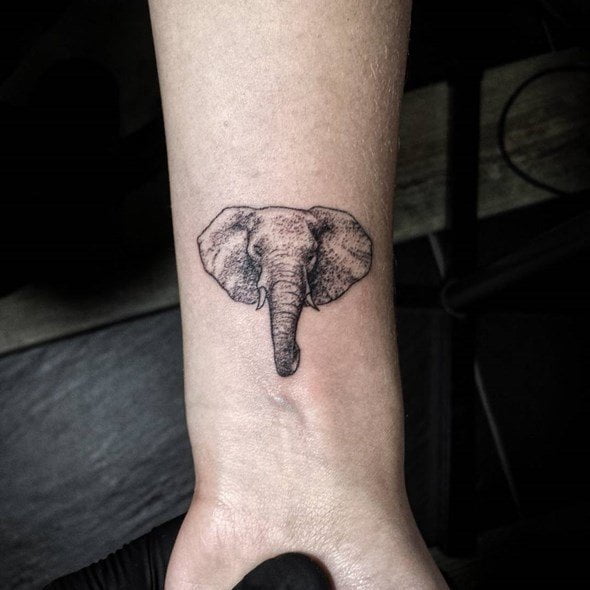 A cool elephant head tattoo on the arm