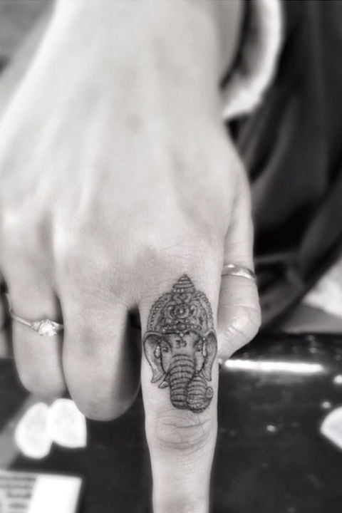 ring finger tattoo