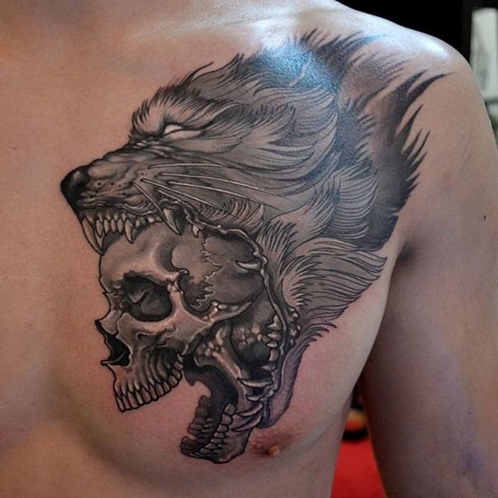 Awesome wolf skull tattoo on a guy’s breast