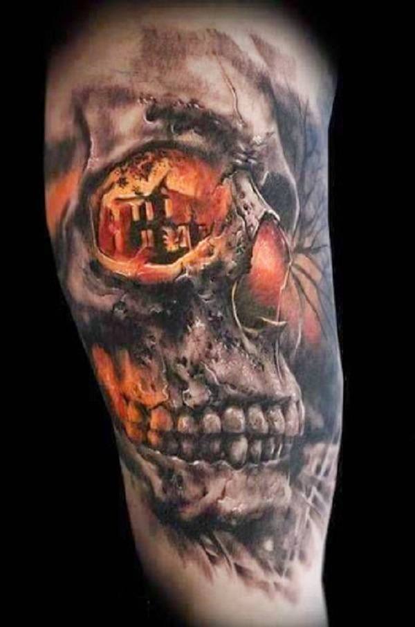 Fire, light, large skull tattoo on arm