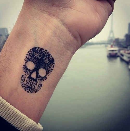 Simple wrist dead skull tattoo