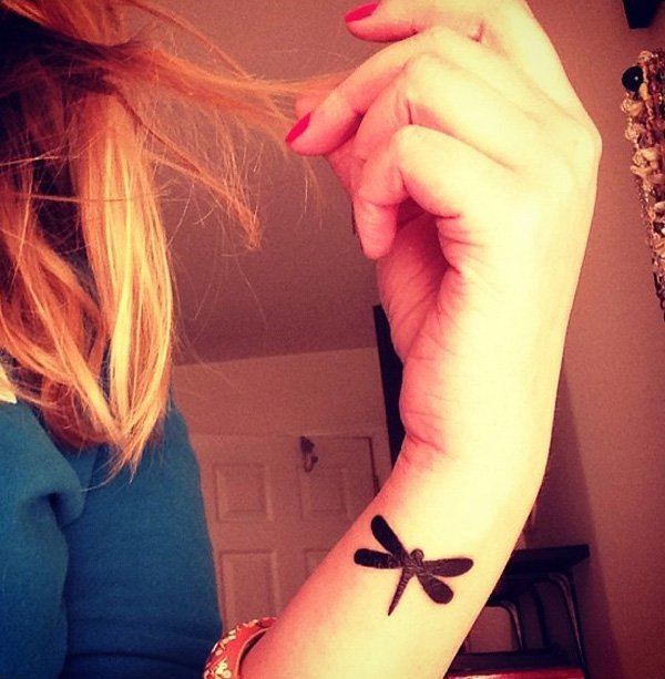 Paper wasp tattoo on wrist