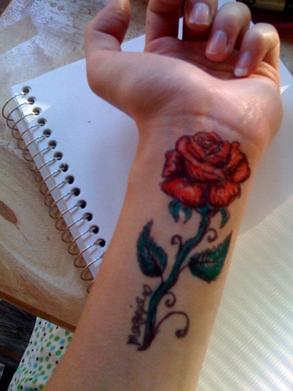Carnation tattoo on wrist