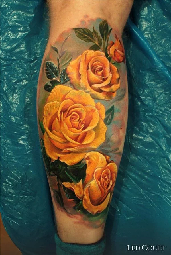 Orange rose tattoo on the right side of the hip