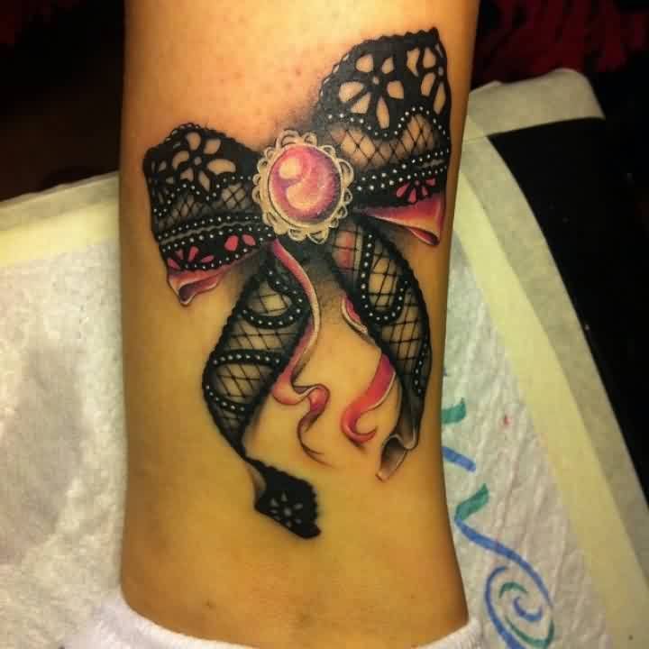 lower back jewel tattoos