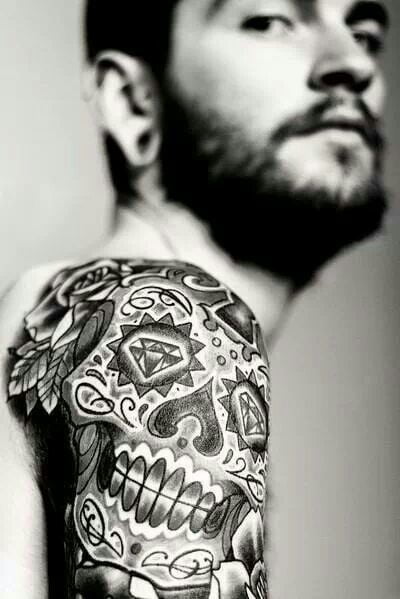 Cool aztec skull tattoo on a man’s arm