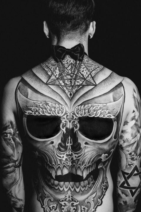 Epic skull tattoo on a guy’s back