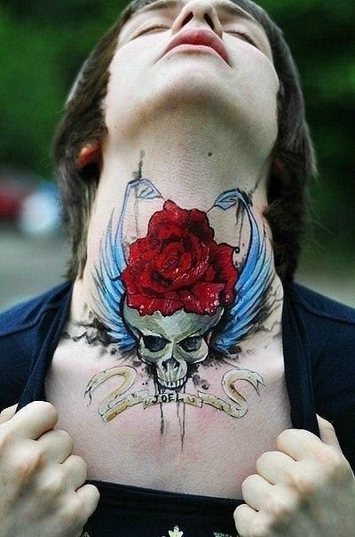 Inscribed sugar skull tattoo with a red rose