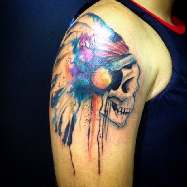 Multi-colored Aztec skull tattoo on arm