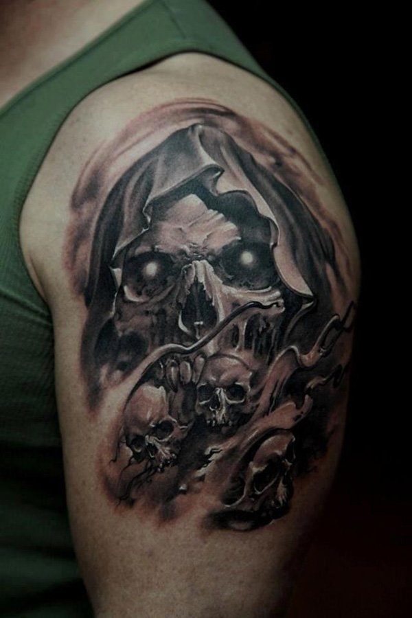 Skull tattoo on upper arm