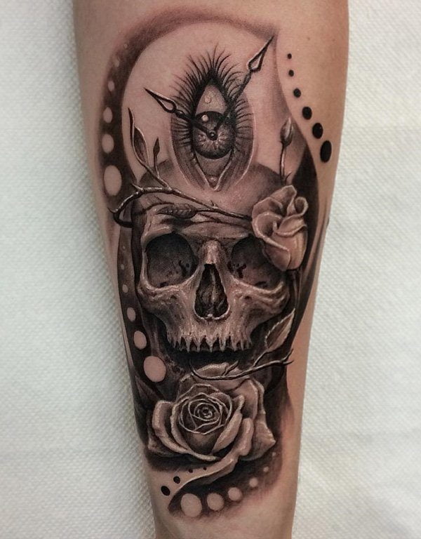 Leg skull and rose tattoo