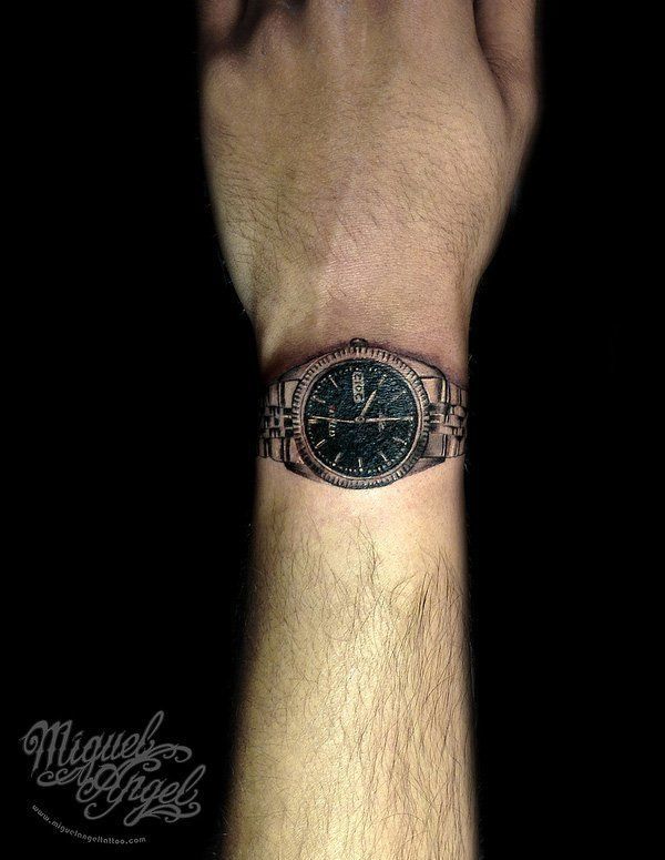 Metal watch tattoo on wrist