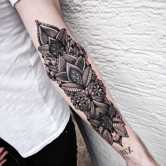 outer forearm tattoo, cross forearm tattoo