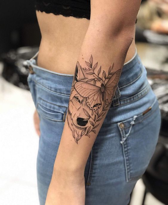 wolf forearm tattoo