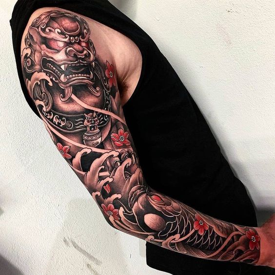 Jaguar and Scales Under Waves and Flowers Half Sleeve Tattoo