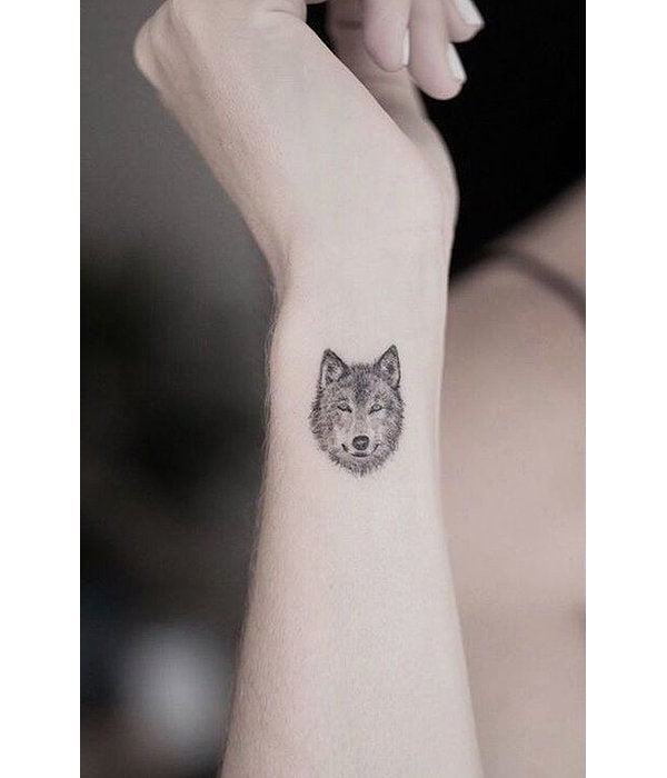Tiny Lone Wolf Tattoo