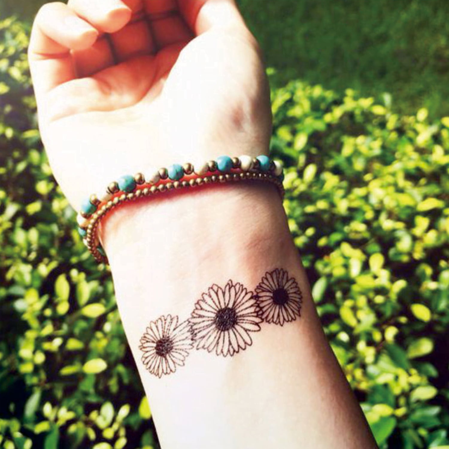 minimalist sunflower tattoo