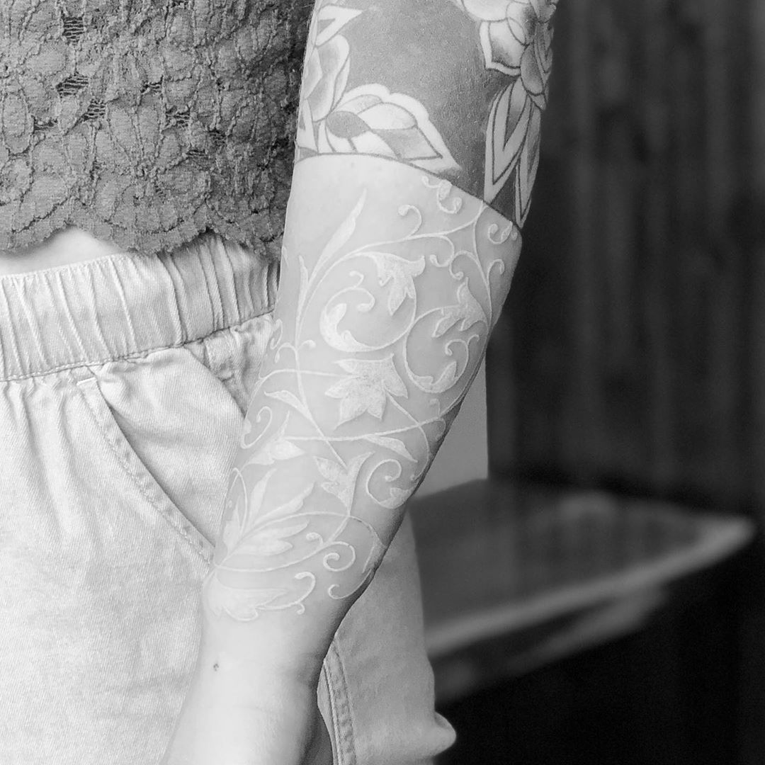 Delicate Lace Flourishes on the Skin White Ink Tattoos