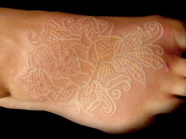 Intricate and Elegant Floral Placement White Ink Tattoos