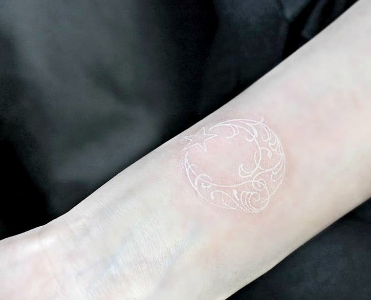 Celestial White Ink Tattoos Design with Flourish Embellishments