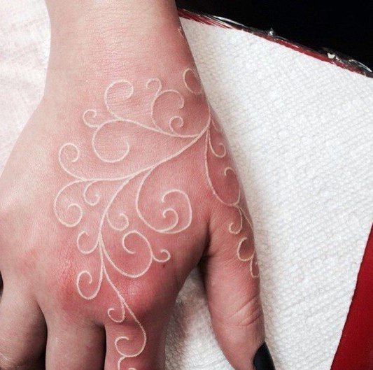 Accessorize Without the Flashy Jewelry on this White Ink Tattoos from Tattoo Artists