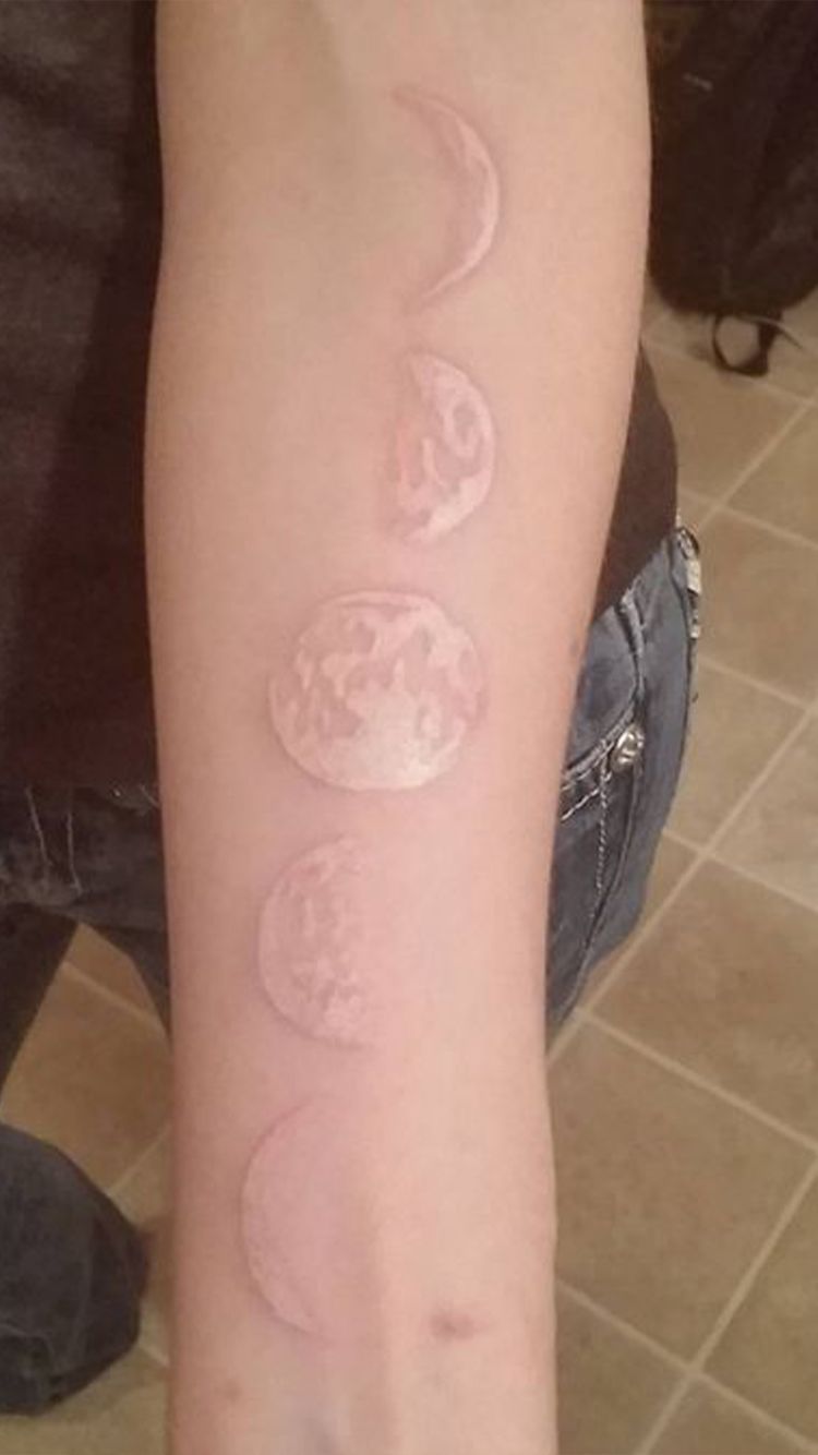 A Realistic Take on Moon Phases White Ink Tattoos for Darker Skin