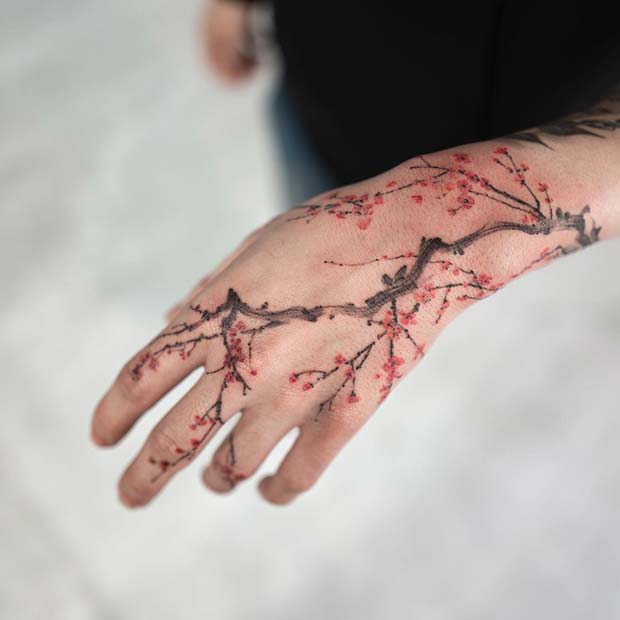 Beautiful Cherry Blossom Hand Tattoos for Men, bold tattoo