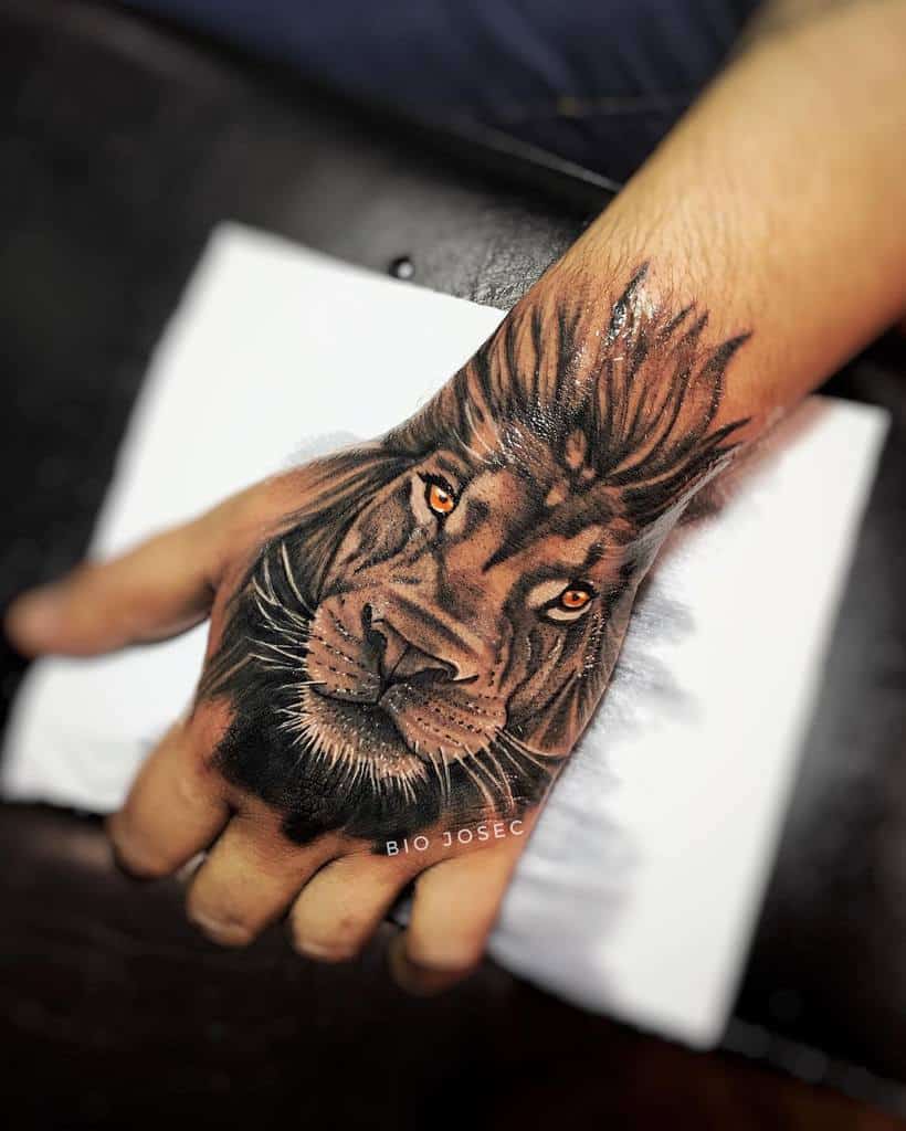 Golden Eyed Lion Tattoo on Hand