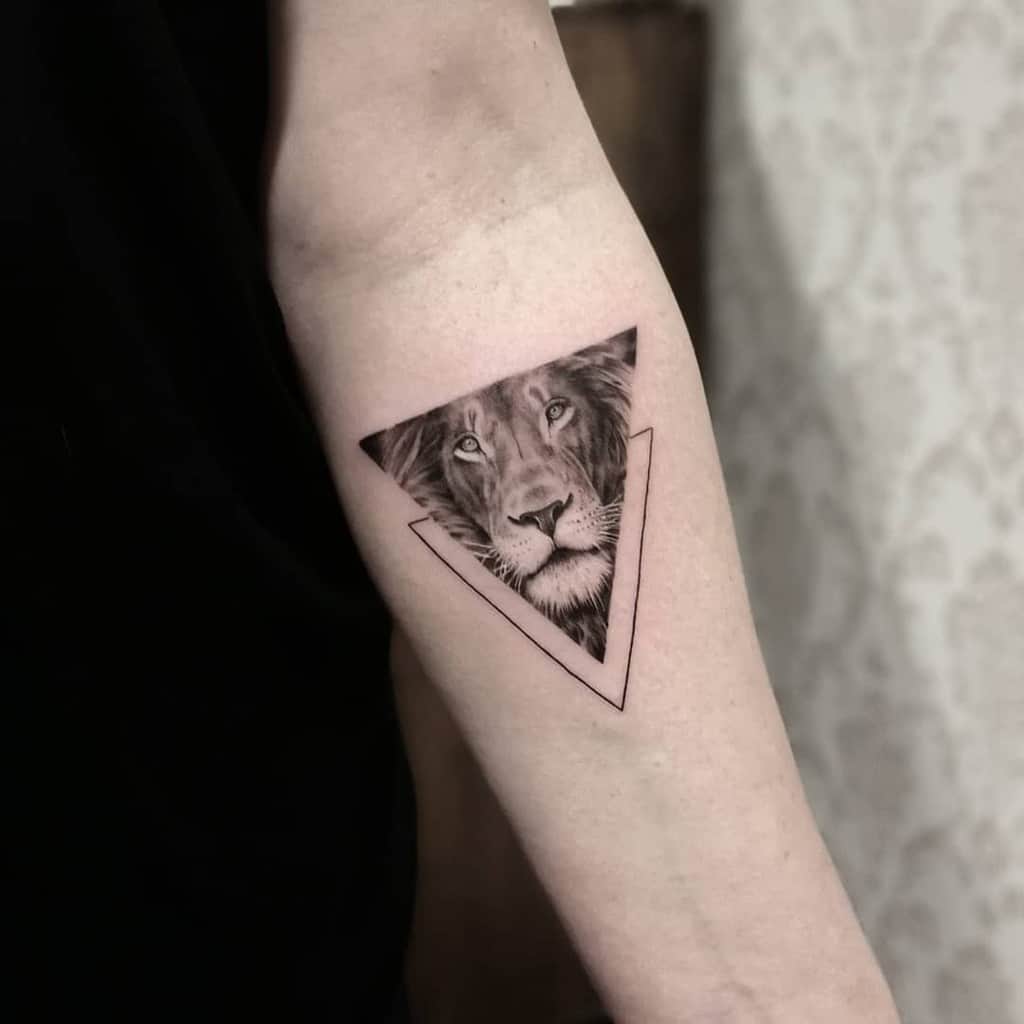 Lion Tattoo Ideas: Lifelike Lion Face in Triangle Tattoo