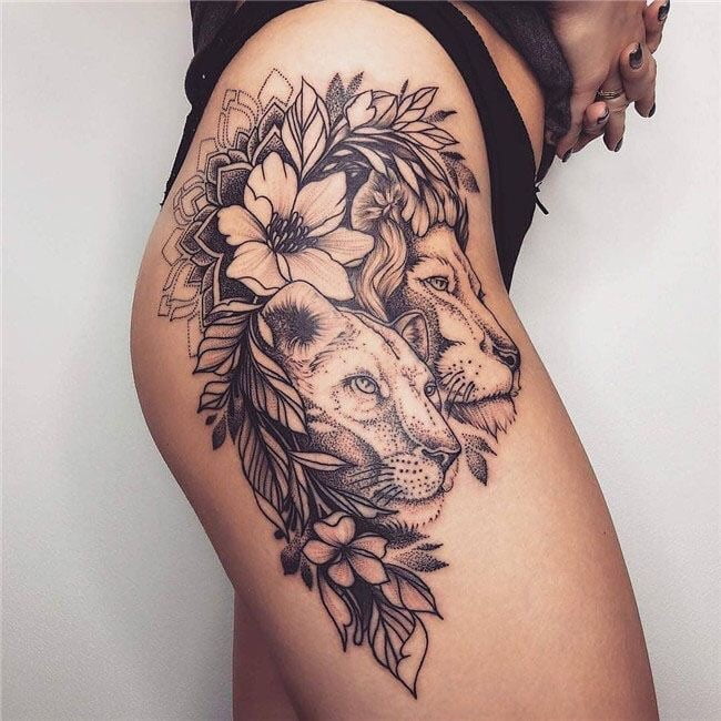 Lion and Lioness Tattoo with Floral Accents