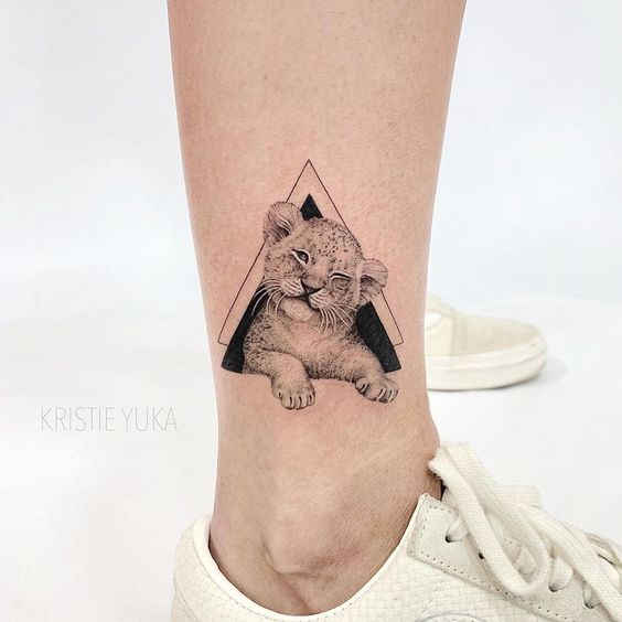 Small Lion Tattoo, Winking Lion Cub Tattoo in Double Triangle