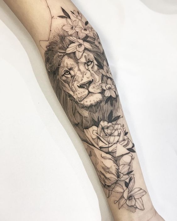 Tribal Lion Tattoo: Photorealistic Lion and Flowers Tattoo on Forearm