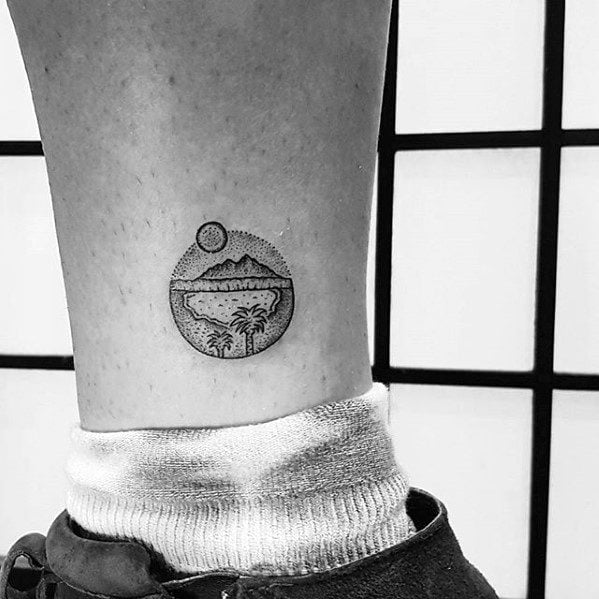 Tiny Oasis Scene in a Circle ankle tattoos