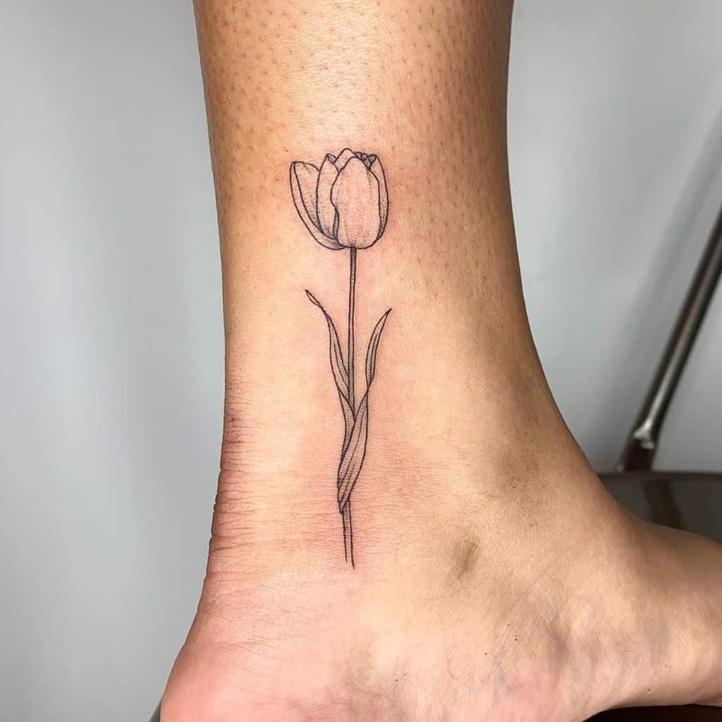 Single Tulip Stem with Leaves Ankle Tattoos