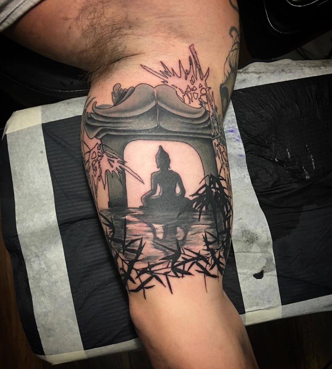 Buddha Figure Under Arch Near Water Inner Bicep Tattoo Ideas