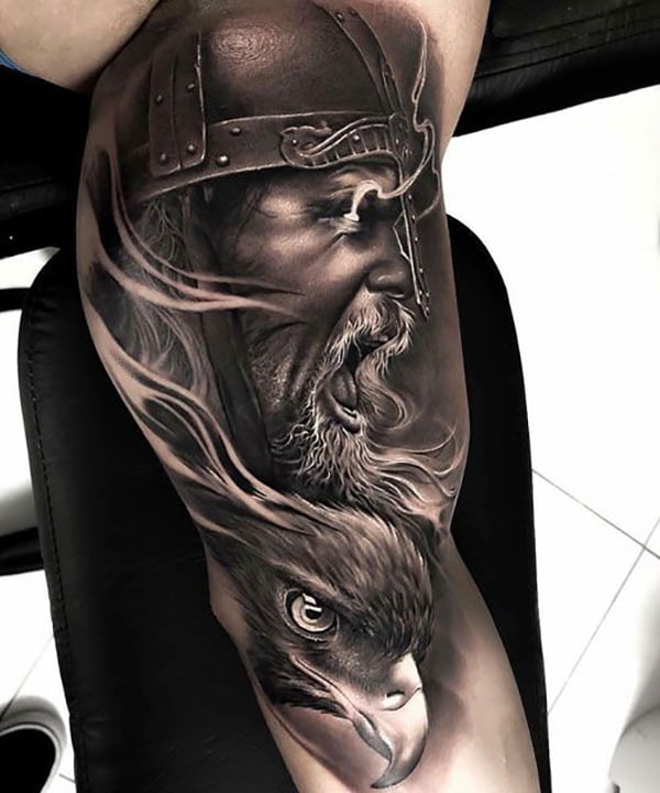 Viking with Glowing Eyes Over Bird Inner Bicep Tattoo