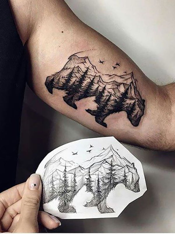 Mountains and Trees Within a Bear Inner Bicep Tattoo Ideas